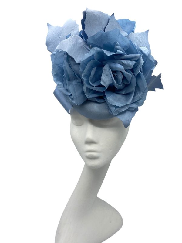 Stunning steel blue headpiece with matching handmade silk flowers.